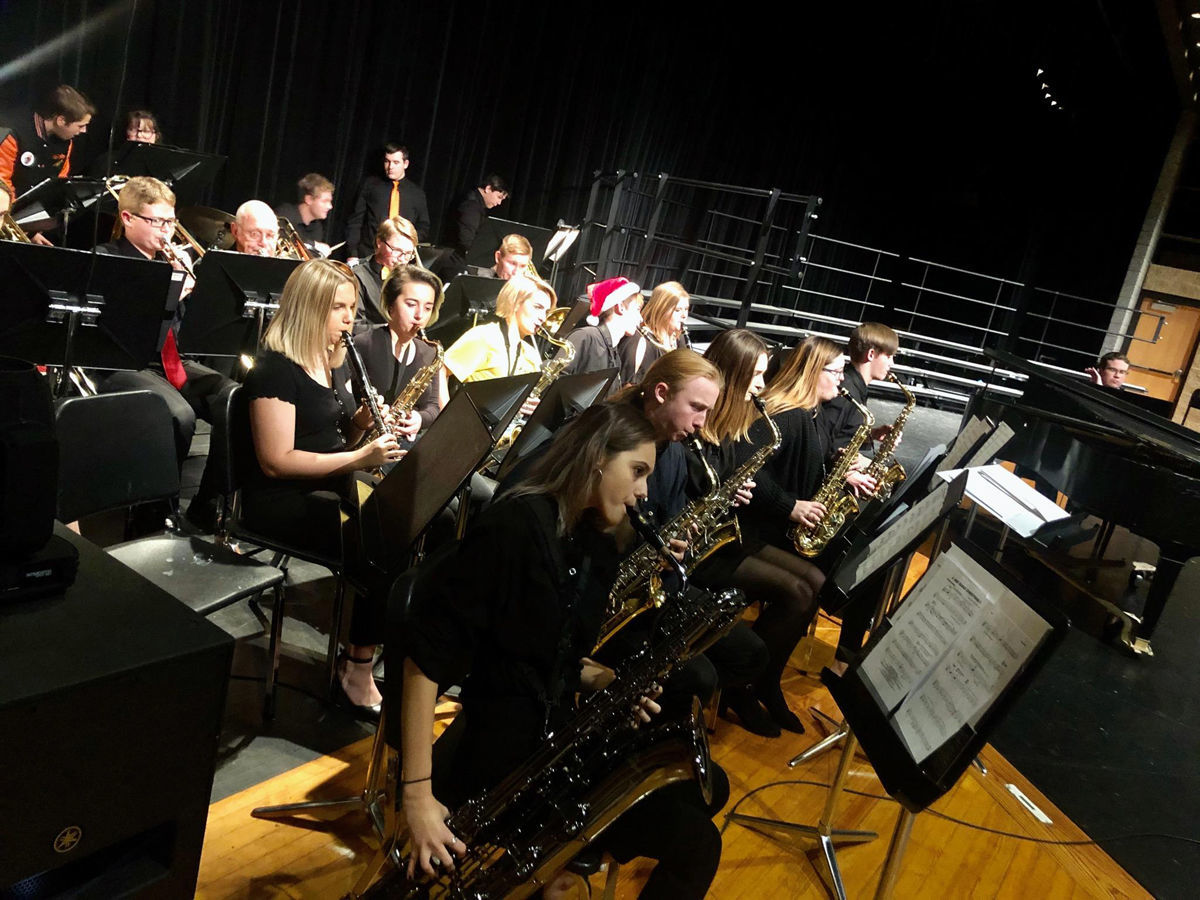 Christmas music fills the air